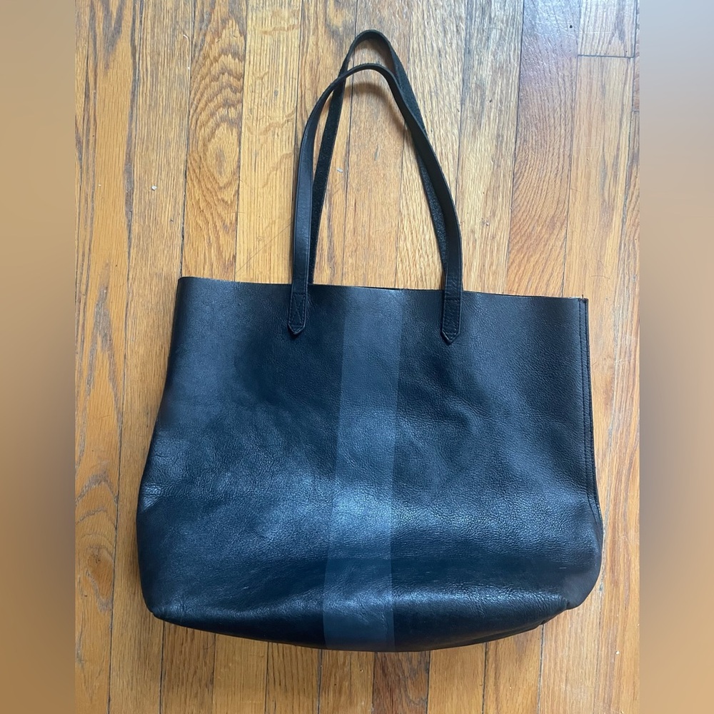 Black paint stripe Leather Transport Tote Bag with zippered pocket.